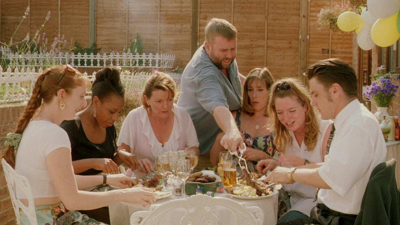 a group of people enjoying a meal outside